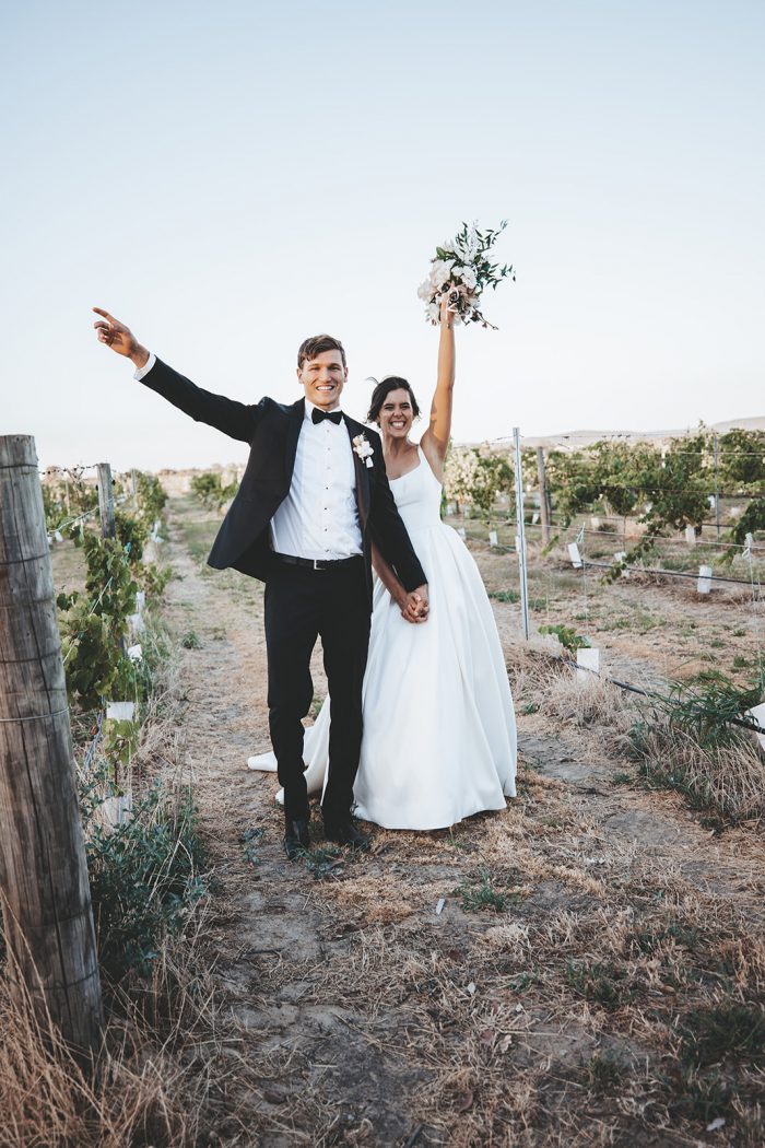 Groom Walking with Bride Wearing Satin A-line Wedding Dress Called Selena by Maggie Sottero