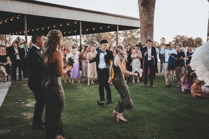 Bridesmaids and Groomsmen Dancing at Wedding Reception at Vineyard Wedding