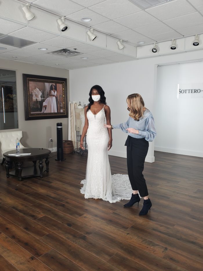 Suzanne Robbins, Director of Sales and Customer Programs At Women Led Business, Maggie Sottero Designs Standing With Bride Wearing Wedding Gown