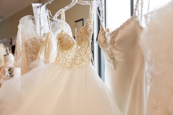 Maggie Sottero wedding dresses hanging up
