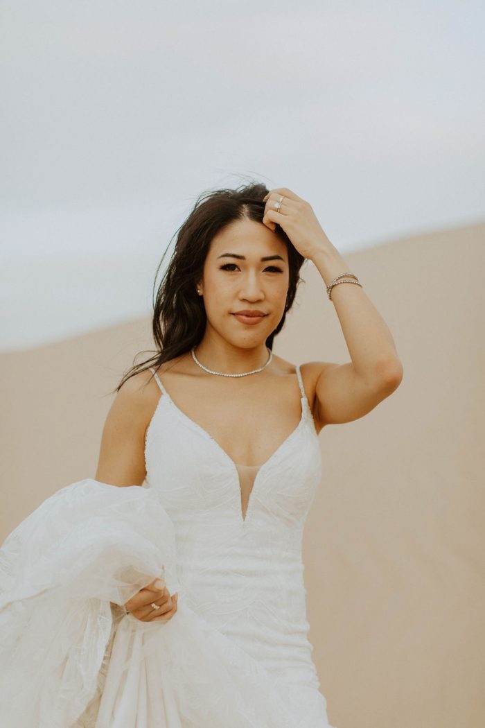 Asian Bride Wearing A Beaded Wedding Dress Called Elsie by Rebecca Ingram In Desert Wedding