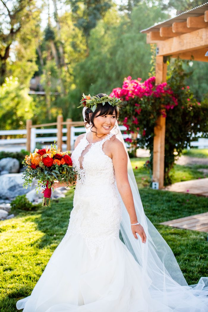 AAPI Bride Wearing A Sexy Wedding Dress Called Veda By Maggie Sottero Walking Down The Aisle