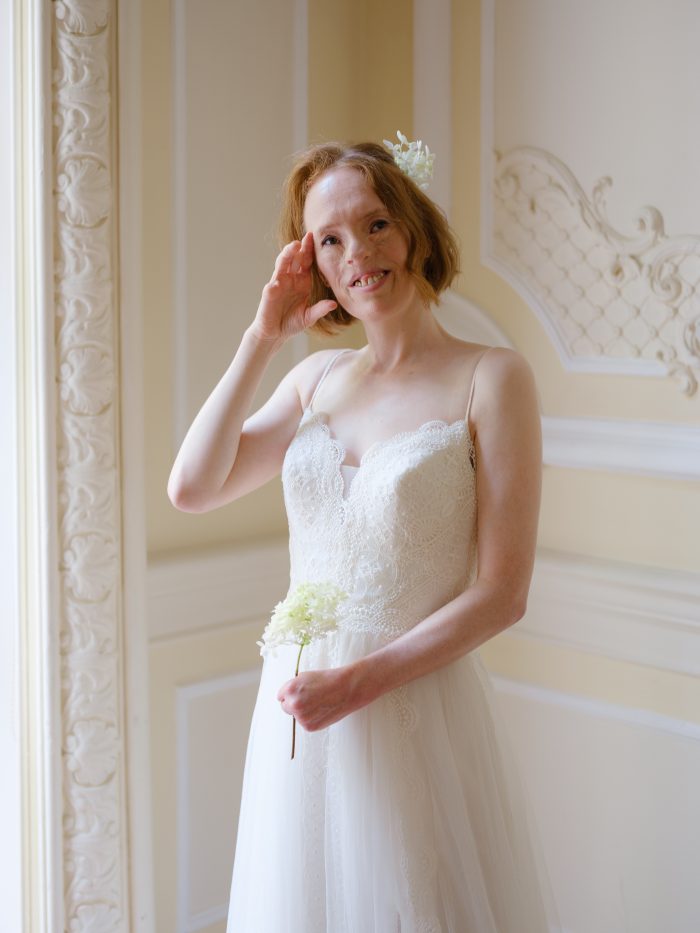 Woman In Wedding Dress With Flowers