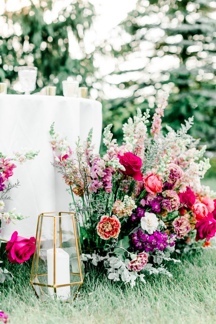 Colorful Pink and Purple Florals with Candle for Rustic Bohemian Wedding Reception
