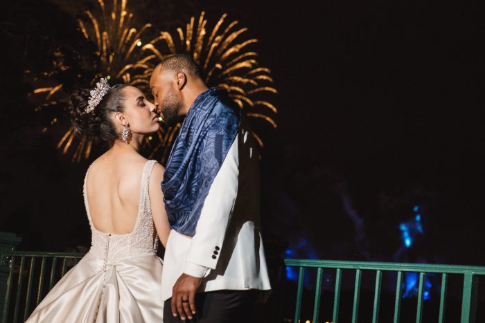 Groom with Real Bride Wearing Princess Wedding Dress Watching Fireworks at Disney World the Magic Kingdom