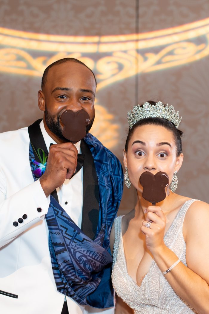 Groom with Real Bride at the Grand Floridian Eating Mickey Ice Cream Bars During Their Reception