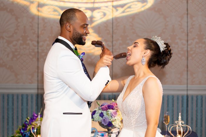Groom with Real Bride at the Grand Floridian Eating Mickey Ice Cream Bars During Their Reception