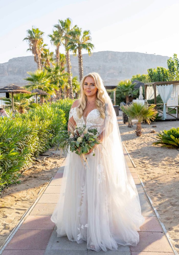 Bride wearing Hattie Marie wedding dress by Rebecca Ingram