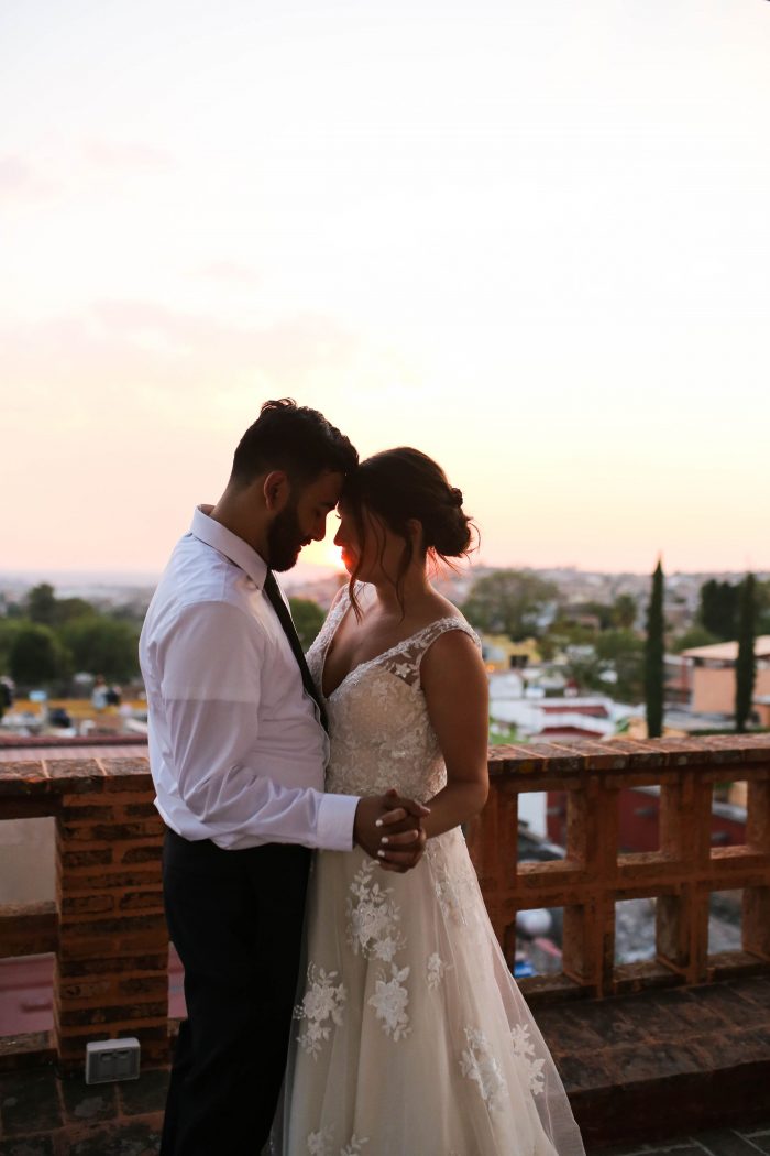 Groom with Real bride dancing on rooftop in Mexico