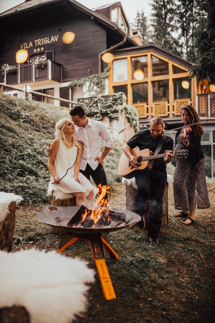 Couple in the woods, making smores