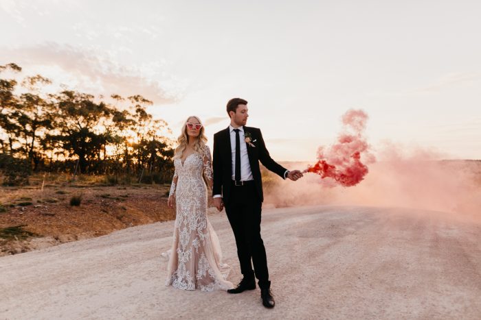 Groom with Real Bride Wearing Illusion Sleeve Sheath Wedding Dress Called Dakota by Sottero and Midgley