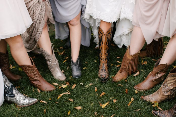 Bridesmaids Wearing Assorted Cowgirl Boots at Country Wedding