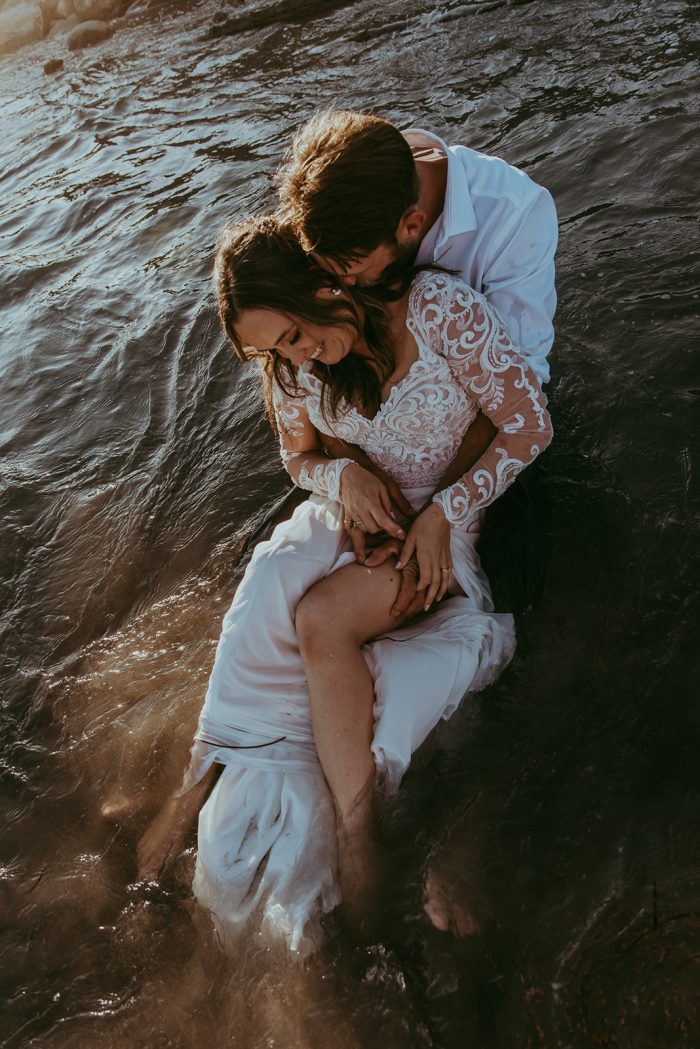 Bride wearing Lorraine Dawn wedding dress by Rebecca Ingram to her destination wedding