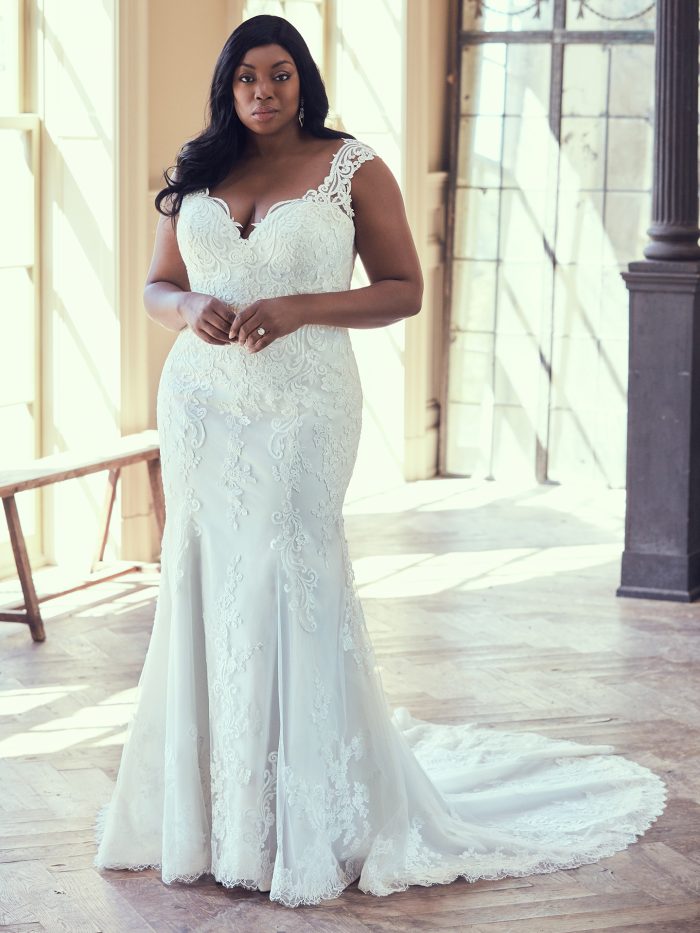 Plus Size Model Wearing Plus Size Sheath Wedding Gown Called Brecklyn Lynette by Maggie Sottero