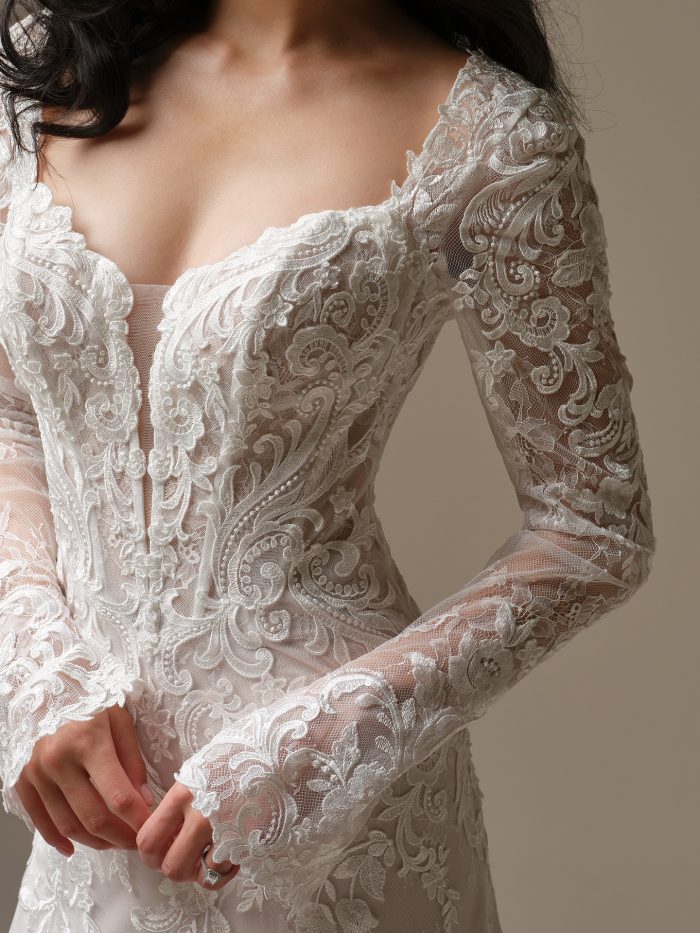 Farrah sleeves by Maggie Sottero, detachable illusion lace bridal sleeves featuring embroidered motifs, fitted design, and scalloped cuffs for a romantic statement look.