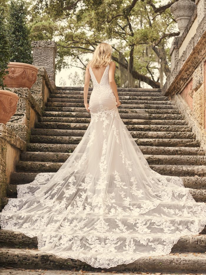 Bride Wearing Lace Sheath Wedding Dress with a Long Wedding Dress Train Called Fontaine by Maggie Sottero