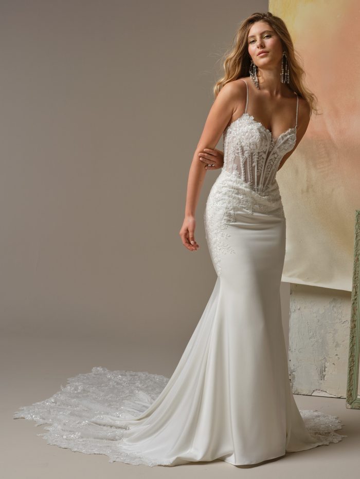 India sheath wedding dress with Trento satin skirt, sparkle tulle illusion bodice with beaded and sequin lace, beaded spaghetti straps, and an extended scalloped lace train.
