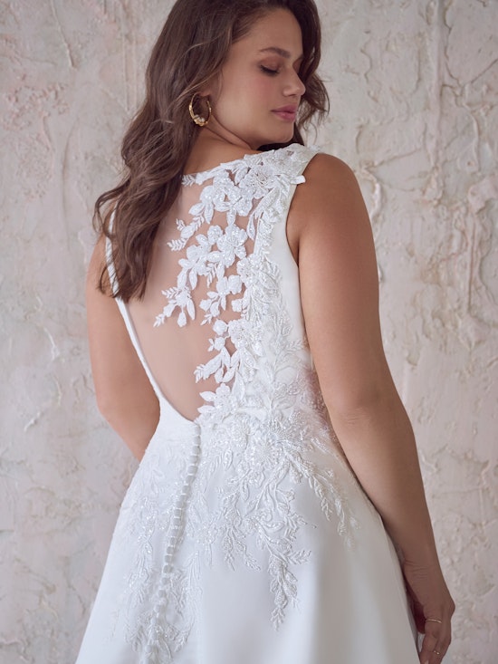 Bride wearing Paxton by Maggie Sottero with embellishment accessory