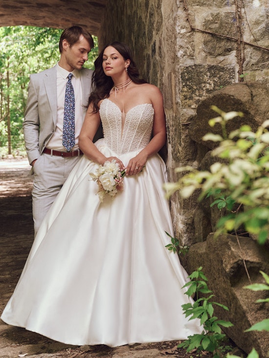 Bride wearing pearl wedding dress called Tina by Maggie Sottero