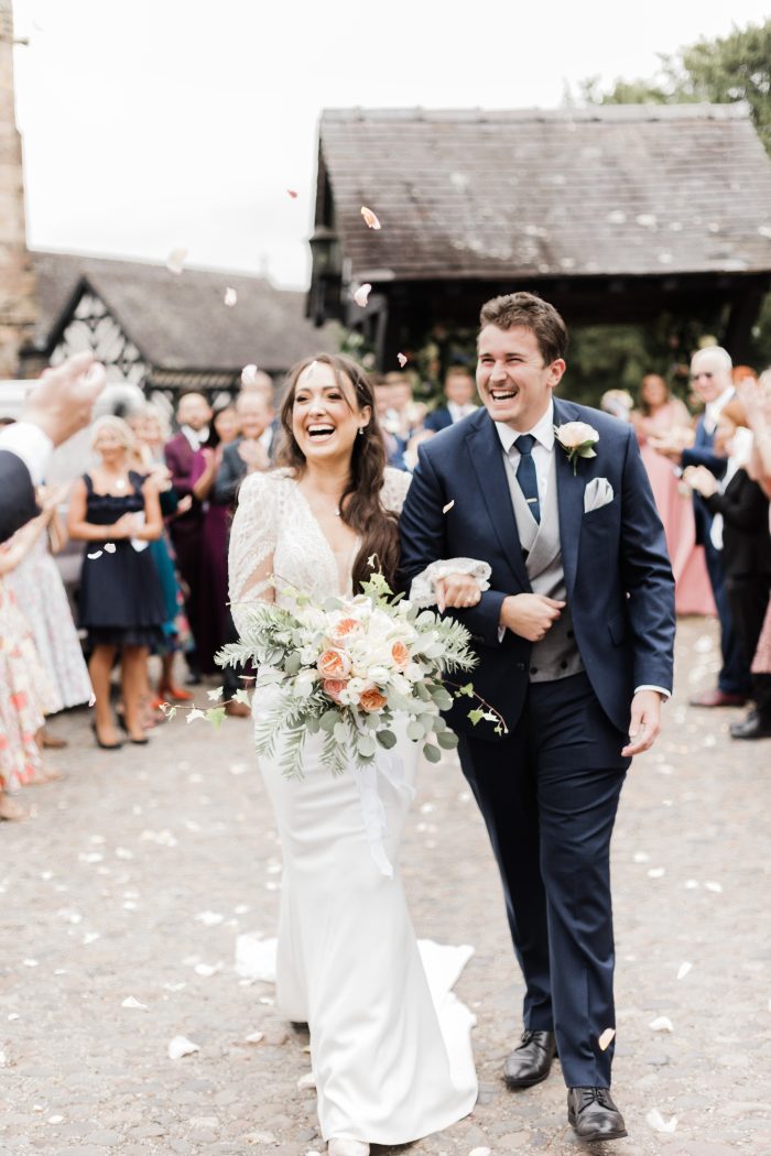Bride wearing Nikki wedding dress by Maggie Sottero with her husband.