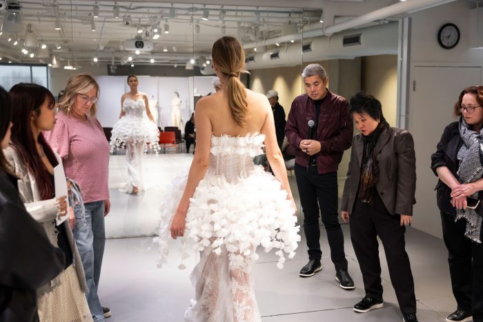 Model wearing a wedding dress designed by Otis students during upcycling mentorship project