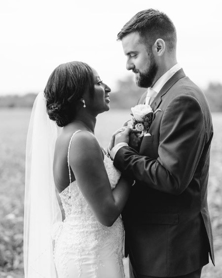 BBride and Groom bridal portraits with Bride wearing Nola lace sheath wedding dress by Maggie Sottero