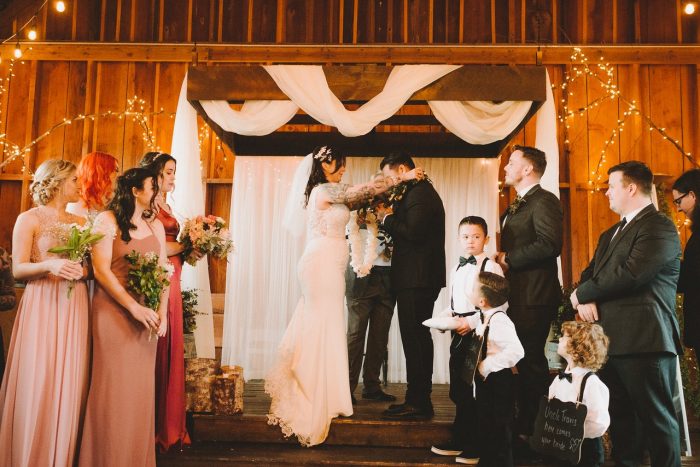 Real Bride Putting Lei on Groom During Hawaiian Ceremony
