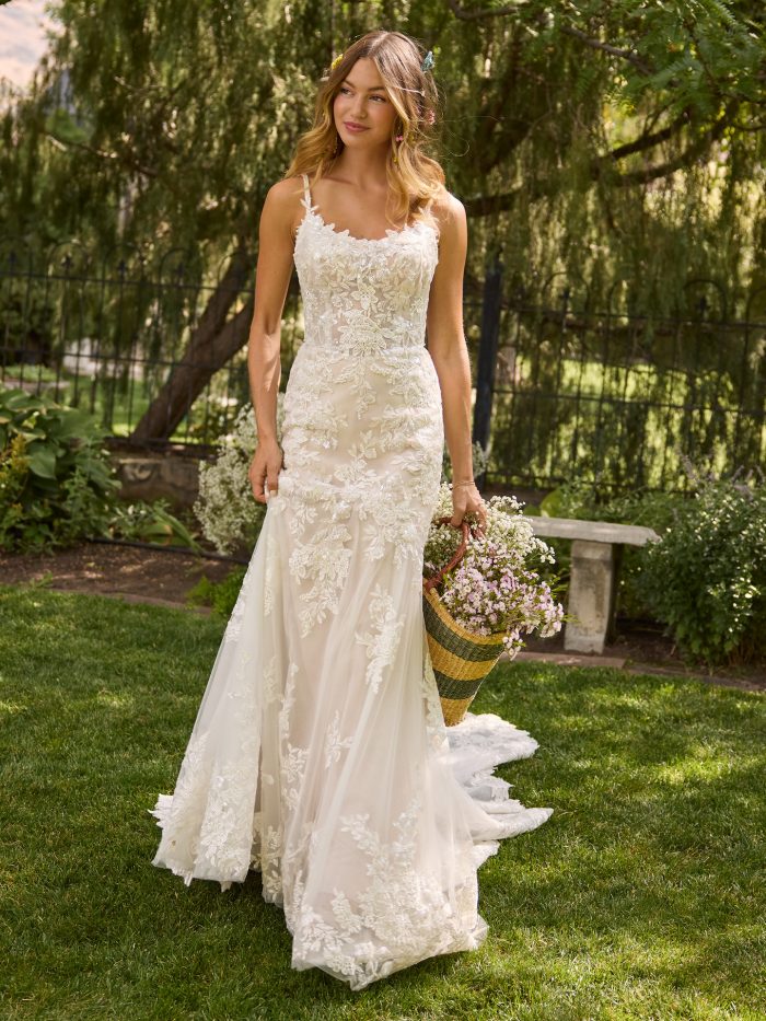 Full-length view of the Eden fit-and-flare wedding dress by Rebecca Ingram featuring pearl-embellished floral lace, delicate spaghetti straps, and a soft garden-inspired silhouette.