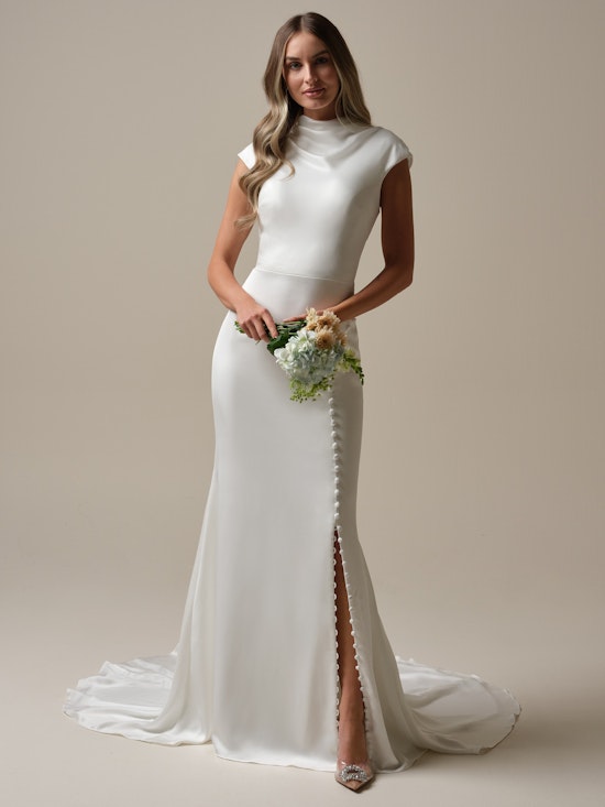 Bride wearing a modest cowl neckline cap-sleeve sheath bridal dress