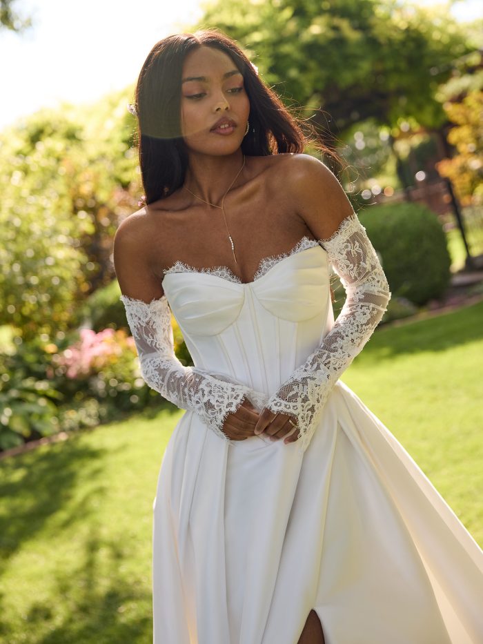 Close-up view of Zorina wedding dress by Rebecca Ingram, showing exposed boning details and peakaboo lace on the sweetheart neckline.
