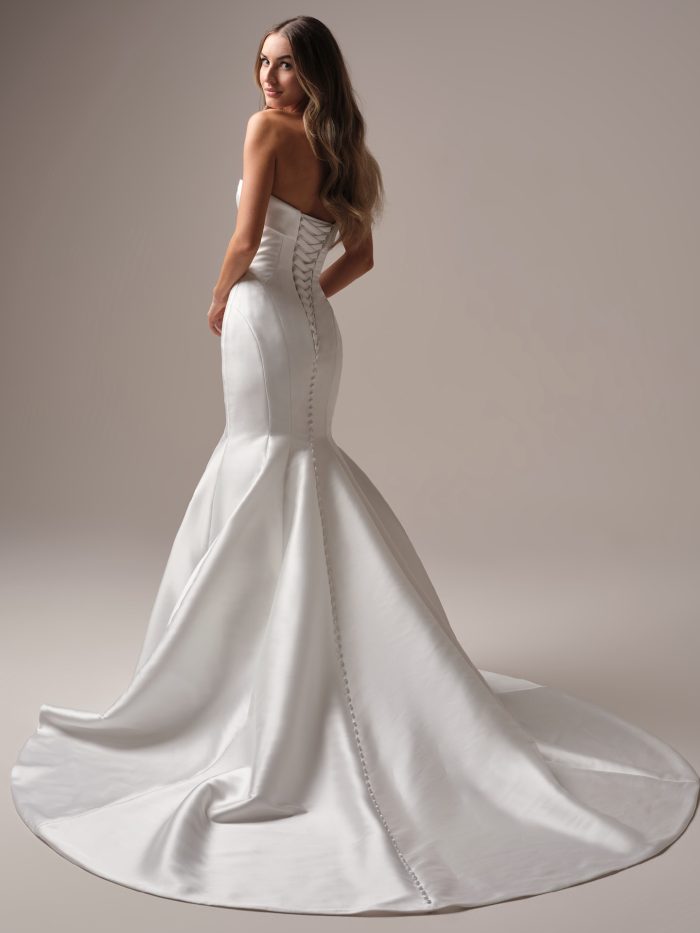 Back view of the Aberdeen Vida Lane wedding dress by Sottero and Midgley with a lace-up corset closure and dramatic fit-and-flare Mikado skirt