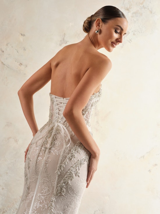 Bride showing the corset lace up back with a dainty bow