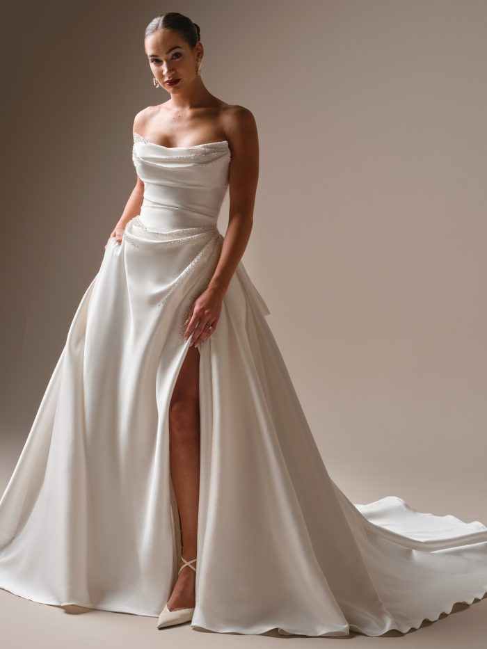 Sottero and Midgley Kincaid satin ballgown wedding dress with strapless draped bodice and thigh-high slit