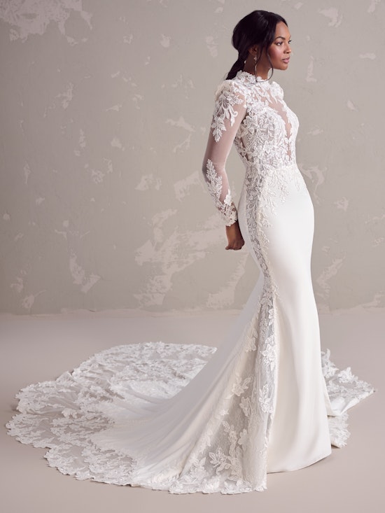 Bride wearing a sheath wedding dress with lace sleeves