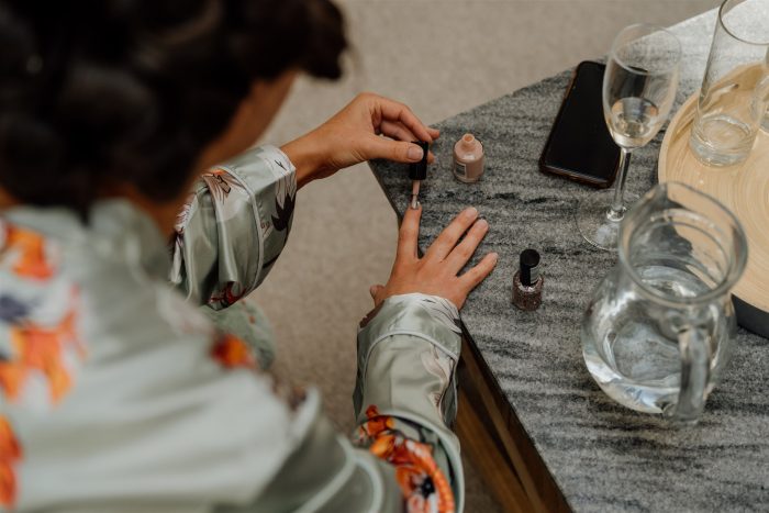 Bride painting her nails