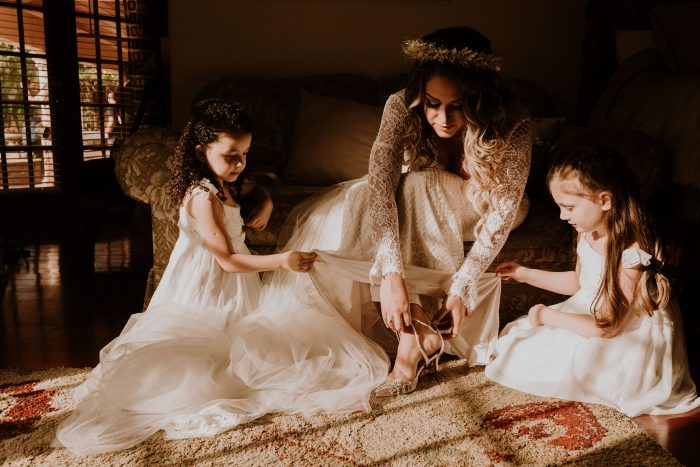 Real Bride Putting on Boho Wedding Shoes