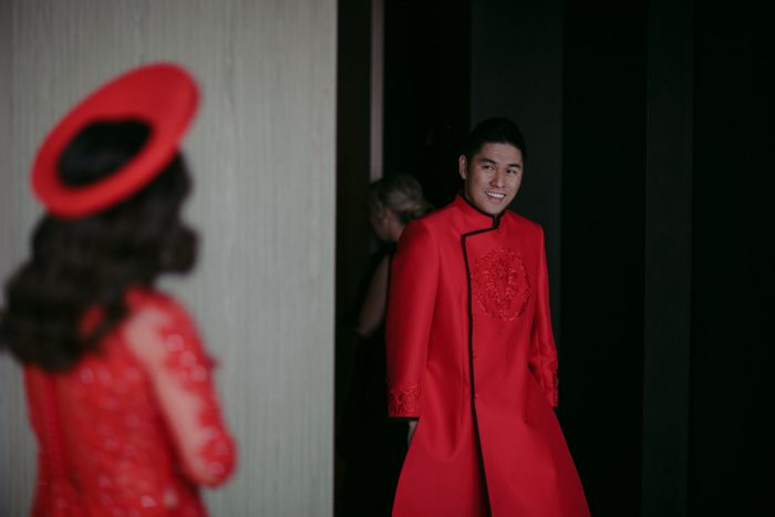Chinese Bride and Groom Wearing Traditional Red Clothing for Chinese Wedding