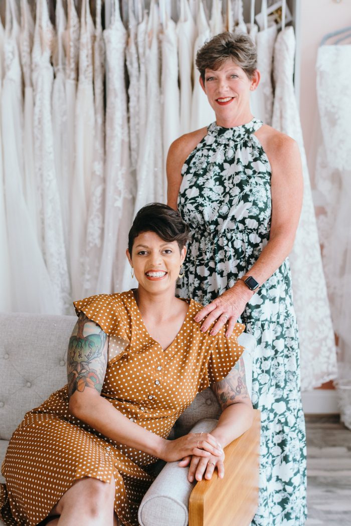 Photo Of Owners Of Urban Set Bride Standing In Front Of Maggie Sottero Wedding Gowns