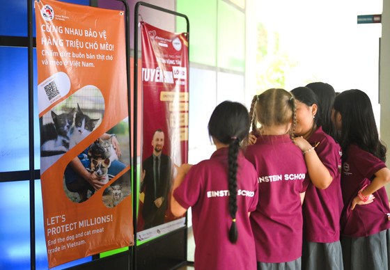 Children infront of two banners in Vietnam