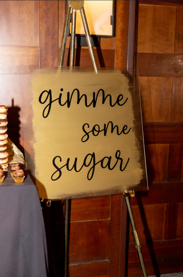 "Gimme some sugar" sign at Katie and Curly's New Year's Eve wedding