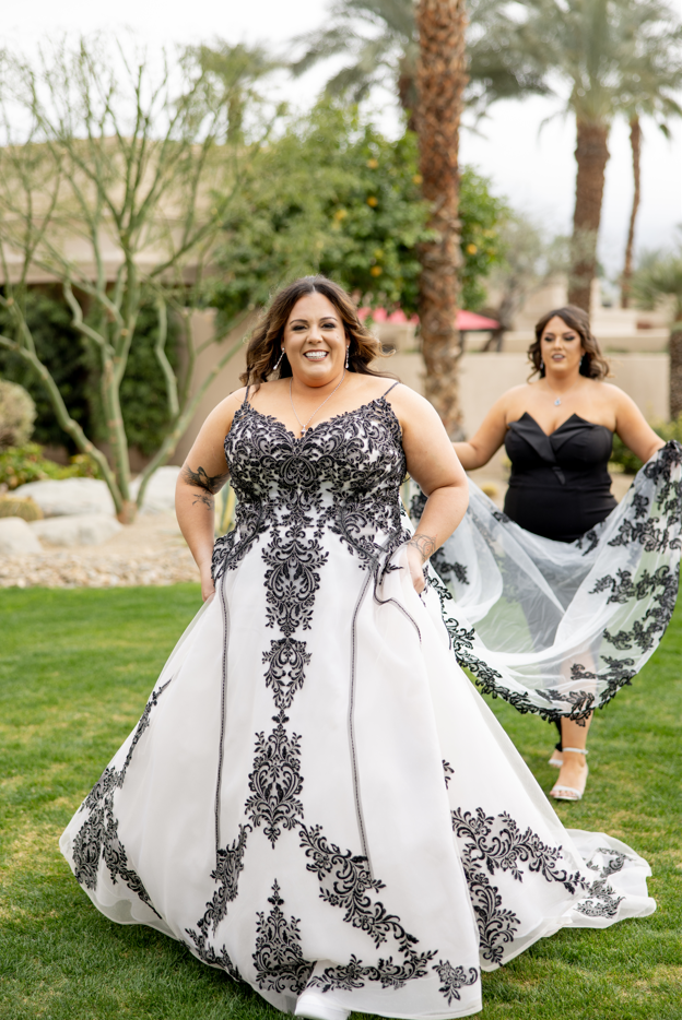 Curly, wearing Tristyn wedding gown by Maggie Sottero