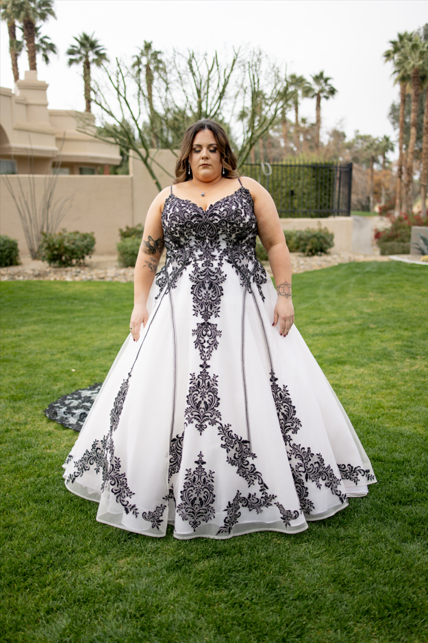 Curly, wearing Tristyn wedding gown by Maggie Sottero